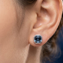 Load image into Gallery viewer, Blue square-cut crystal stud earring worn on a woman’s ear
