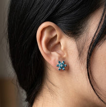 Load image into Gallery viewer, Blue Flower Swarovski Crystal Earrings worn on a woman's ear MysticFlavia
