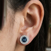Load image into Gallery viewer, Blue Swarovski crystal stud earring worn on a woman's ear by MysticFlavia
