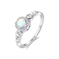 Blue opal ring with round gemstone and sparkling halo in a silver circle band | MysticFlavia