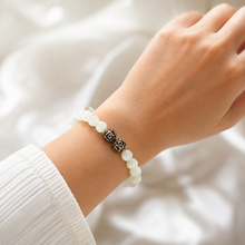 Load image into Gallery viewer, MysticFlavia Cat Eye Pine Stone Silver Bead Bracelet 8MM worn by a female model in soft natural light

