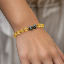 Load image into Gallery viewer, MysticFlavia citrine bracelet worn on a wrist showcasing natural citrine beads and silver bead accents
