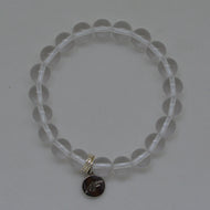 MysticFlavia clear quartz flat silver bead bracelet 8MM with round brand charm pendant, flat lay on white background