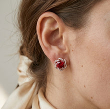 Load image into Gallery viewer, Woman wearing crimson blossom stud crystal earring, close-up on ear.
