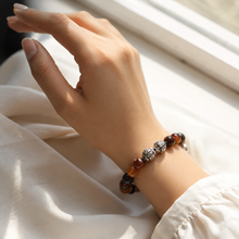 Load image into Gallery viewer, Woman wearing Dream Agate stone silver bead bracelet 8mm in soft natural window light
