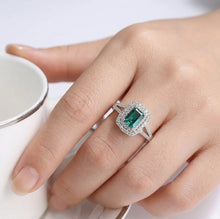 Load image into Gallery viewer, Emerald cut blue gemstone 925 sterling silver ring worn on a woman's finger
