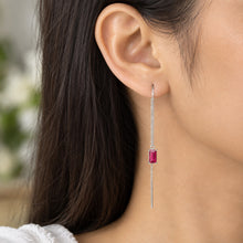 Load image into Gallery viewer, Ruby thread earring worn on a model ear, featuring a rectangular red gemstone and silver chain

