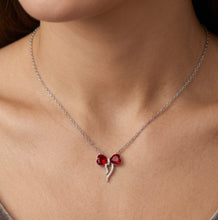 Load image into Gallery viewer, Woman wearing Eternal Heart pendant crystal silver necklace with a small red heart crystal bow pendant
