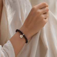 Load image into Gallery viewer, Elegant Garnet Birthstone Flat Silver Bead Bracelet 8mm with polished natural gemstone beads and silver charm by Mystic Flavia.
