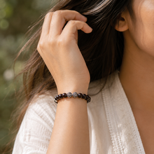 Load image into Gallery viewer, Woman wearing Garnet Birthstone Silver Bead Bracelet 8MM with natural garnet gemstone beads and sterling silver accents by Mystic Flavia
