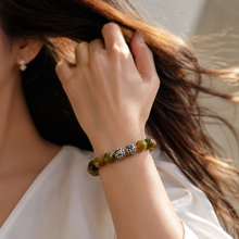 Load image into Gallery viewer, Woman wearing Grape Agate stone silver bead bracelet 12mm with decorative silver beads on wrist
