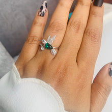 Load image into Gallery viewer, Green Swarovski crystal hummingbird ring worn on hand, detailed silver design, MysticFlavia
