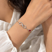 Load image into Gallery viewer, Red Swarovski Crystal Heart Infinity Bracelet worn on wrist | MysticFlavia
