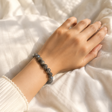 Load image into Gallery viewer, Female model wearing Labradorite Stone Silver Bead Bracelet 8MM with decorative silver spacer beads for an elegant everyday look
