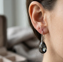 Load image into Gallery viewer,  Swarovski teardrop earring worn on ear with silver hook – MysticFlavia
