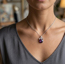 Load image into Gallery viewer, Woman wearing Monaco star circle crystal silver necklace with a grey V-neck top
