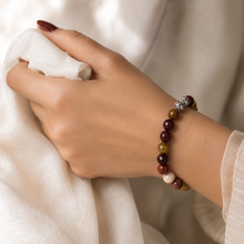 Load image into Gallery viewer, Woman wearing Mookaite Jasper Faceted Stone Silver Bead Bracelet 8MM with natural faceted gemstone beads and 925 sterling silver spacer beads | MysticFlavia
