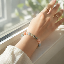 Load image into Gallery viewer, Natural Morganite Stone Silver Bead Bracelet 8mm worn on a woman's wrist in soft natural light for an elegant everyday look.
