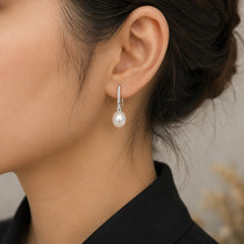 Load image into Gallery viewer, Natural white pearl zircon silver drop earrings worn on a model
