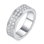 Moissanite ring featuring a wide double-row band of round-cut stones in polished silver, front angled view.
