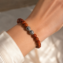 Load image into Gallery viewer, Woman wearing Red Jasper Stone Silver Bead Bracelet 8mm with engraved silver beads for an elegant everyday look | MysticFlavia
