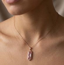Load image into Gallery viewer, Woman wearing Rosaline Radiance crystal silver necklace with a pink rectangular crystal pendant
