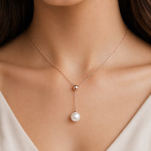 Load image into Gallery viewer, 925 sterling silver pearl lariat necklace styled on a woman’s neck for an elegant look
