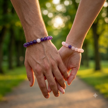 Load image into Gallery viewer, Couple wearing MysticFlavia Amethyst and Rose Quartz bracelets while holding hands outdoors
