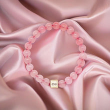 Load image into Gallery viewer, MysticFlavia pink bead bracelet styled on soft satin fabric with 925 sterling silver infinity charm
