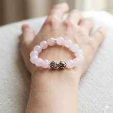 Load image into Gallery viewer, MysticFlavia rose quartz bracelet worn on wrist with polished 12MM pink stone beads
