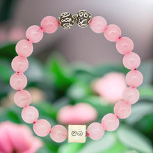 Load image into Gallery viewer, Rose quartz bracelet with natural pink beads and silver accents in floral background by MysticFlavia

