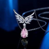 925 sterling silver butterfly pendant necklace with pink teardrop gemstone on black background