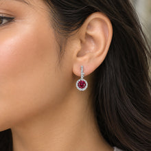 Load image into Gallery viewer, Ruby gemstone 925 sterling silver drop earrings worn on a model
