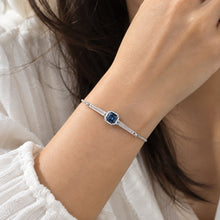Load image into Gallery viewer, Blue Swarovski crystal bracelet worn on a woman's wrist by MysticFlavia
