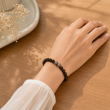 Load image into Gallery viewer, Female model wearing Smoky Quartz Stone Silver Bead Bracelet 8mm with 925 sterling silver beads in a warm lifestyle setting.
