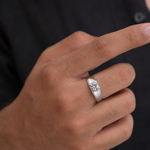 Load image into Gallery viewer, Men’s Moissanite ring worn on a finger, showcasing a polished silver band and sparkling center stone
