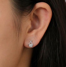 Load image into Gallery viewer, St._Vince_Solitaire_MOISSANITE_Queens_Earrings001 worn by a women
