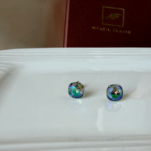 Load image into Gallery viewer, Swarovski crystal stud earrings, close-up top view on white surface with box in background.
