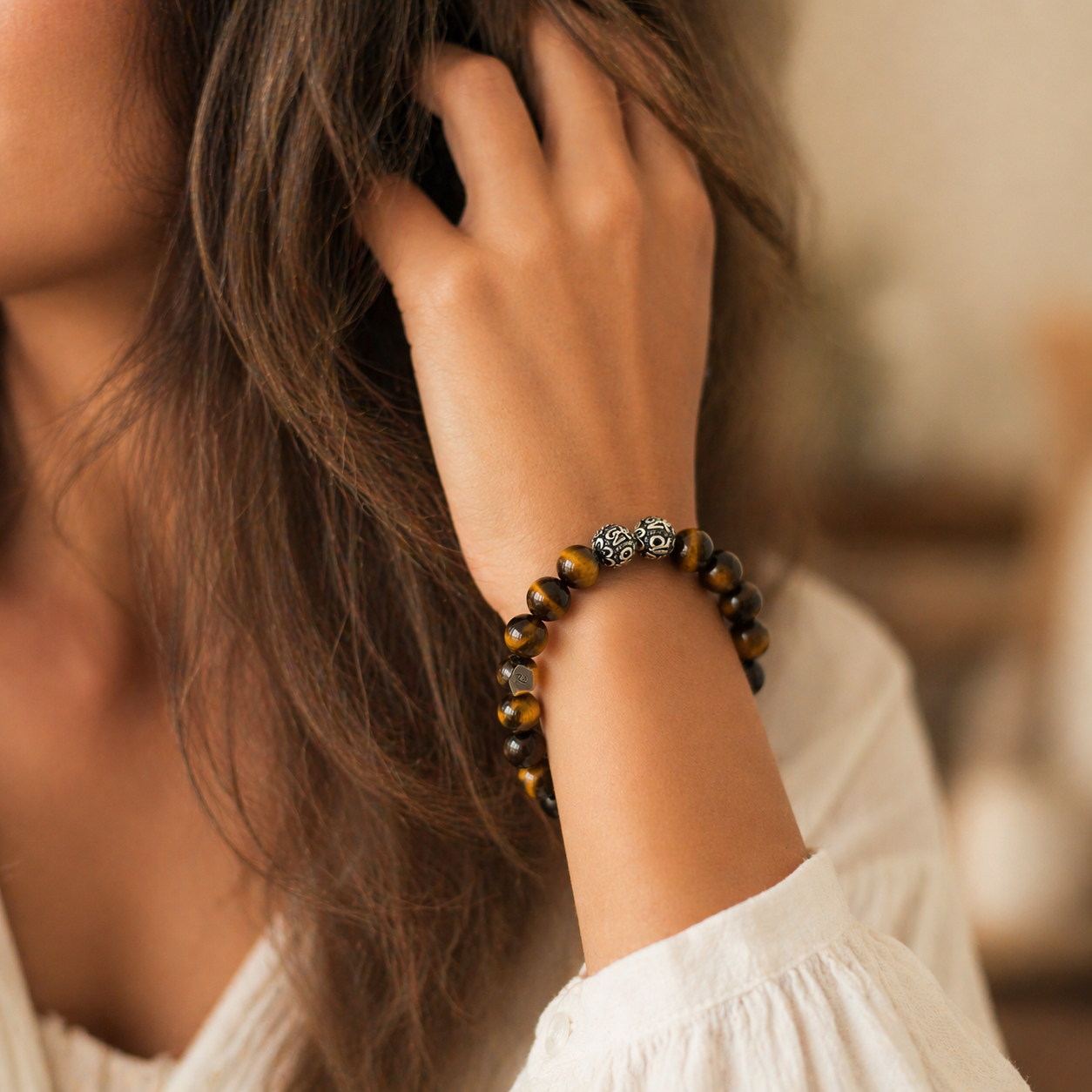 Load image into Gallery viewer, Woman wearing MysticFlavia tiger eye bracelet on wrist, lifestyle shot