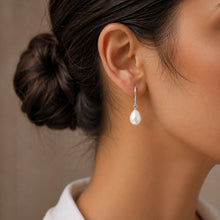 Load image into Gallery viewer, Tear drop natural pearl earrings crafted in 925 sterling silver, worn by a model
