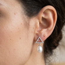 Load image into Gallery viewer, Triangle pearl silver earring with natural white pearl worn on a model ear, MysticFlavia
