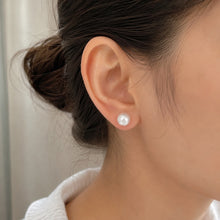 Load image into Gallery viewer, MysticFlavia 11 MM natural pearl stud silver earring worn on a model’s ear with a minimal elegant look
