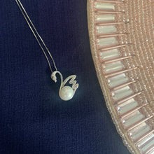 Load image into Gallery viewer, 925 sterling silver natural pearl swan necklace on a blue jewelry background
