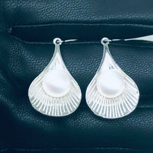 Load and play video in Gallery viewer, Bali Natural Pearl Dangling Silver Earrings
