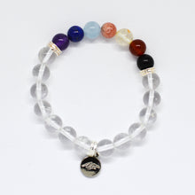 Load image into Gallery viewer, 7 Chakra Clear Quartz bracelet close-up showing round beads and engraved silver charm

