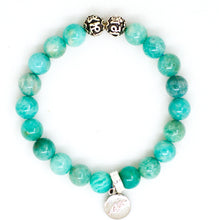 Load image into Gallery viewer, Amazonite silver bead bracelet with teal-green beads, two carved silver beads on top and round silver brand charm pendant, white background

