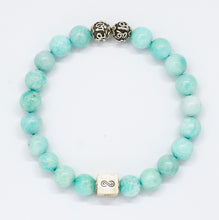 Load image into Gallery viewer, Amazonite infinity round silver bracelet with soft teal-green beads, two carved silver beads on top and square infinity charm, white background

