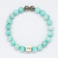 Amazonite infinity round silver bracelet with soft teal-green beads, two carved silver beads on top and square infinity charm, white background
