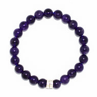 Round amethyst bracelet with deep purple beads and silver spacers on white background by MysticFlavia