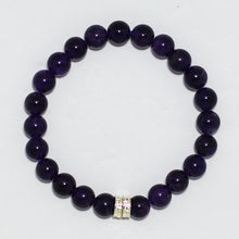 Load image into Gallery viewer, Close-up flat lay of round purple gemstone bracelet with silver spacers on white background
